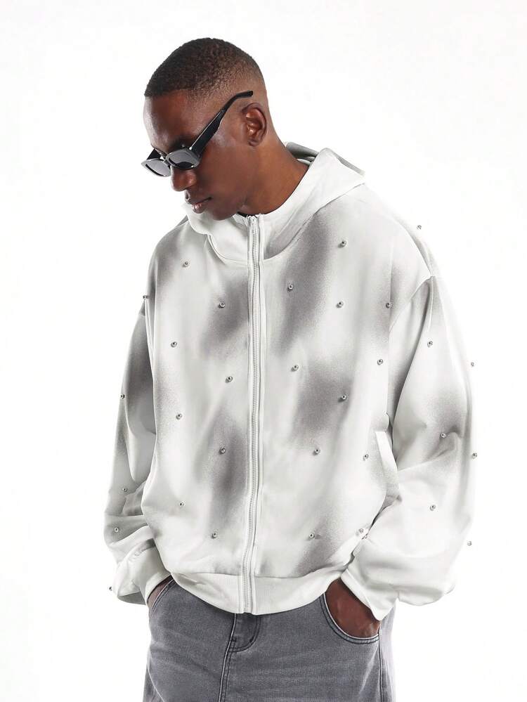 Bluza z kapturem zapinana na zamek i zdobiona perłami