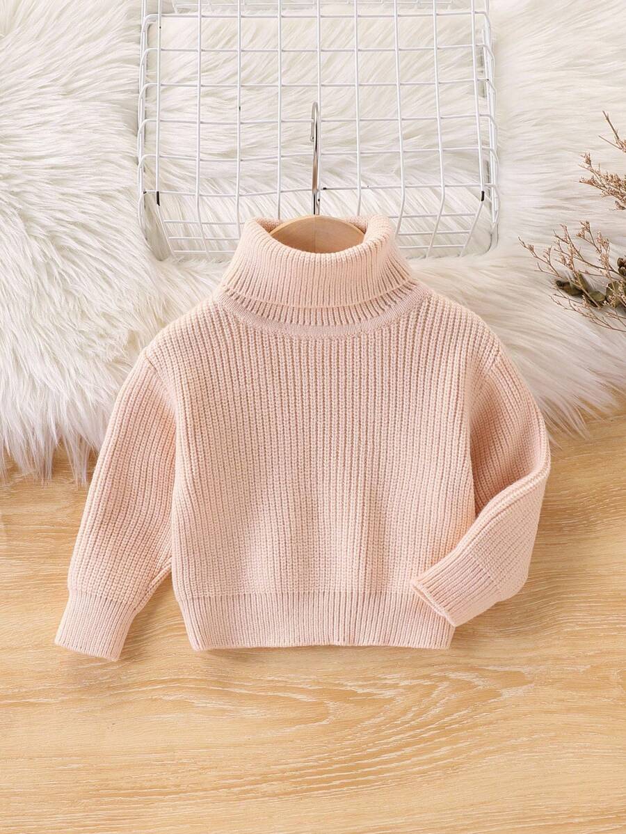 SHEIN Vintaside Kids 女婴/少女秋冬针织毛衣。独特设计,高领设计,展现女孩独特的时尚品味。纯色彰显自然清新气质,可搭配T恤、吊带背心、太阳裙、薄纱裙、连衣裙等多种服饰。舒适的针织面料。前开口设计,方便穿着,更添便捷与时尚感。 - 杏色 - 查看 1