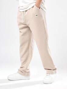 SUMWON Pantalon de jogging de luxe texturé pour garçons pré-adolescents. Motif zigzag doux pour un port confortable toute saison. Avec poches latérales, coupe classique, style de vacances pour l'automne et l'hiver