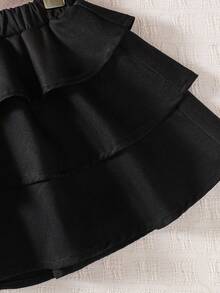 Emery Rose Kids Emery Rose Kids Váy xòe màu trơn phong cách Halloween thường ngày cho bé gái, phối đồ dạo phố, tối giản, thể thao, học viện, phù hợp với mọi mùa (xuân, hạ, thu, đông), mặc ở nhà, tập thể dục ngoài trời, đi học, giải trí hàng ngày. Cùng phong cách với mẹ tôi, cùng phong cách với chị gái và em trai tôi. Váy đen cho bé gái, váy đen xếp nếp nhiều tầng màu đen, váy xòe đen cho bé gái, váy đen trẻ em, váy ngắn màu đen kèm quần short, dài đến đầu gối, váy đen thu đông - màu đen - Xem 6