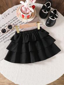 Emery Rose Kids Emery Rose Kids Váy xòe màu trơn phong cách Halloween thường ngày cho bé gái, phối đồ dạo phố, tối giản, thể thao, học viện, phù hợp với mọi mùa (xuân, hạ, thu, đông), mặc ở nhà, tập thể dục ngoài trời, đi học, giải trí hàng ngày. Cùng phong cách với mẹ tôi, cùng phong cách với chị gái và em trai tôi. Váy đen cho bé gái, váy đen xếp nếp nhiều tầng màu đen, váy xòe đen cho bé gái, váy đen trẻ em, váy ngắn màu đen kèm quần short, dài đến đầu gối, váy đen thu đông - màu đen - Xem 5