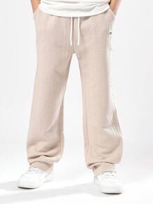 SUMWON Pantalon de jogging de luxe texturé pour garçons pré-adolescents. Motif zigzag doux pour un port confortable toute saison. Avec poches latérales, coupe classique, style de vacances pour l'automne et l'hiver