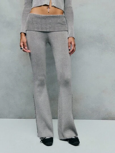TypaGal 这款罗纹针织裤是寒冷天气舒适时尚的完美之选。阔腿剪裁和翻折腰带设计使其在女士秋装和冬装系列中脱颖而出。对于追求舒适的女性来说，这款裤装是理想之选，可搭配秋季毛衣、女士正装上衣，或打造舒适的商务休闲女装和办公室装。