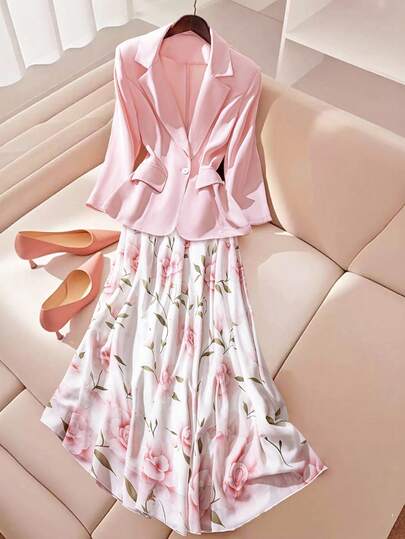 Franclia 这款优雅时尚的秋冬女士粉色长袖西装外套+印花半裙两件套，适合商务休闲、婚礼宾客、日常出行等多种场合，兼具优雅与新颖设计，并充分考虑了秋季搭配和冬季穿着的需求，可轻松打造得体吸睛的女士套装，是兼具实用性和时尚感的女士之选。关键词：女士婚礼宾客服装、优雅外套、女士套装、女士秋季搭配、新款冬季套装、商务休闲套装
