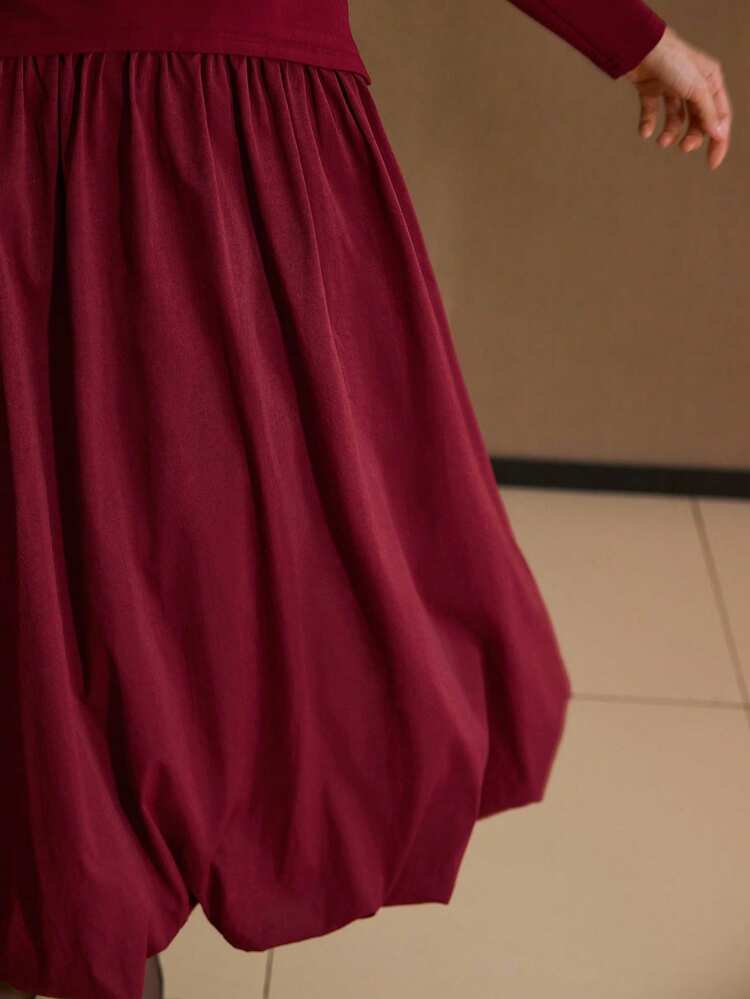 VESTIDO MIDI DE MUJER CON PARCHES DE PUNTO Y BAJO ABULLONADO