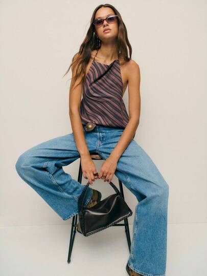 Nöista Halter Neck Top With A Draped Cowl Front, Featuring Fluid Wavy Stripes In Earthy Brown And Black. A Chic Piece That Transitions Seamlessly From Office Layering To Night-Out Glam With Trousers Or Skirts.