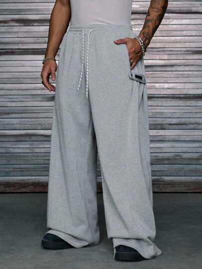 AXEPEAK Pantalones de chándal casuales sueltos con cintura con cordón y bolsillos para hombre