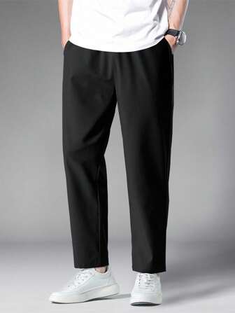 Pantalones casuales holgados de unicolor con bolsillo y corte entallado para hombre, otoño