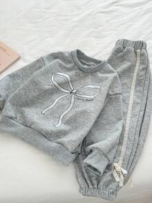 Genkimix Kids 2 Stücke Set für Kleine Mädchen bestehend aus Top mit Schleifendruck und Skinny Hose mit Spitzenbesatz