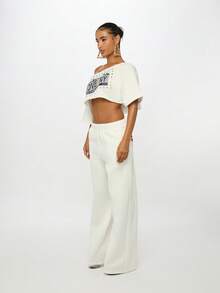 SUMWON WOMEN Bold Back Print High Rise White Baggy Jogger Pants Loose Fit Elastic Waist Street Style Loungewear Fall Winter Fashion Statement Text Print - White - View 4