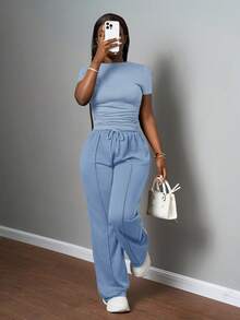 Slaydiva Bộ đồ nữ thường ngày màu trơn, cổ tròn, tay ngắn và quần ống đứng cạp chun, màu nâu, thích hợp cho mùa xuân hè, các lễ hội âm nhạc, lễ Phục Sinh, lễ Thánh Patrick. - Màu xanh lam - Xem 4