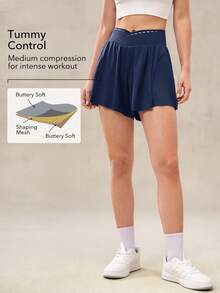 OutZeal Pantalones cortos deportivos para mujer con control de abdomen, absorción de sudor, cintura cruzada, con bolsillo incorporado, para tenis, gimnasio y entrenamiento - Azul - Ver 3