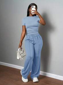 Slaydiva Bộ đồ nữ thường ngày màu trơn, cổ tròn, tay ngắn và quần ống đứng cạp chun, màu nâu, thích hợp cho mùa xuân hè, các lễ hội âm nhạc, lễ Phục Sinh, lễ Thánh Patrick. - Màu xanh lam - Xem 3