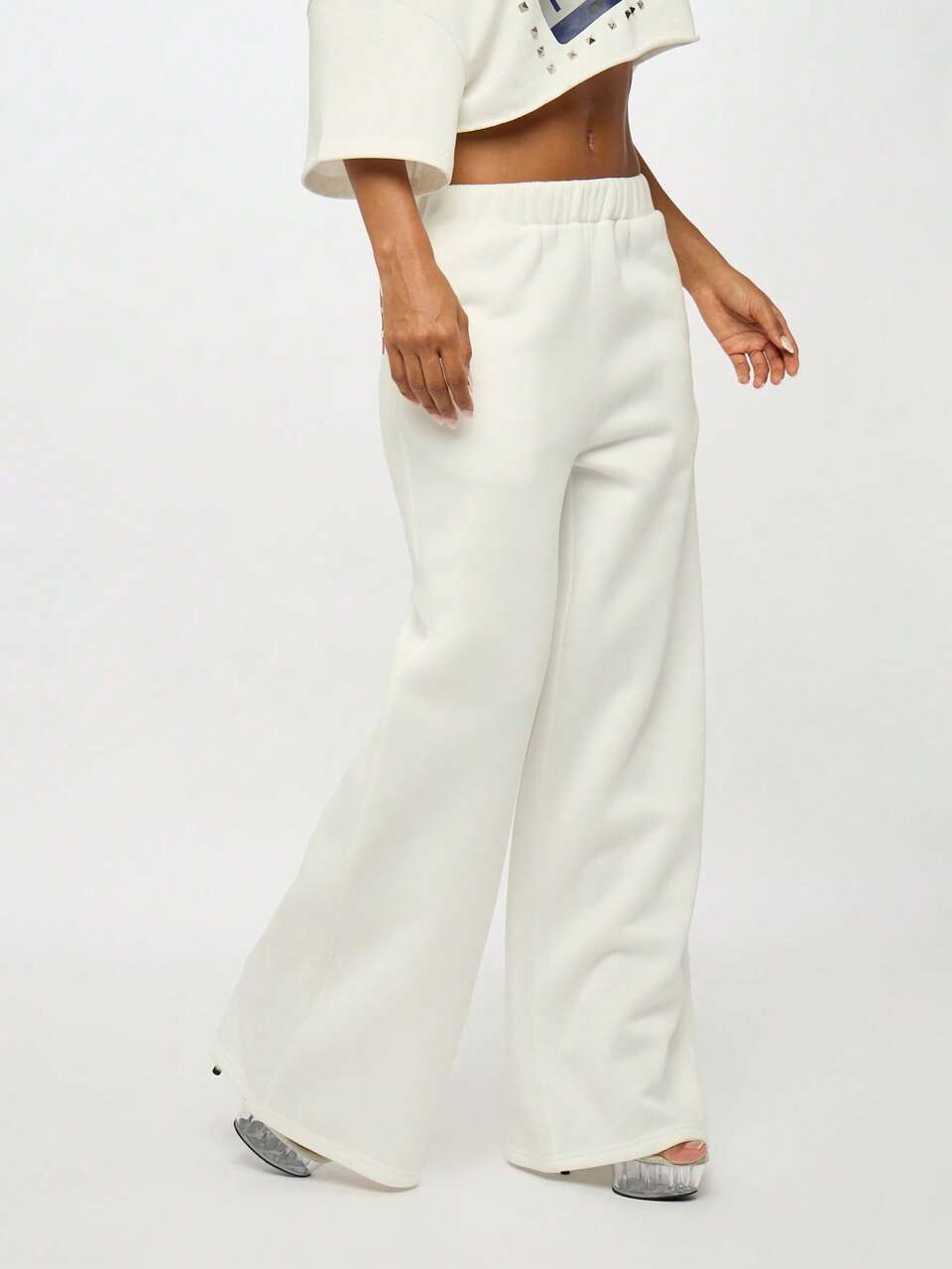 SUMWON Bold Back Print High Rise White Baggy Jogger Pants Loose Fit Elastic Waist Street Style Loungewear Fall Winter Fashion Statement Text Print