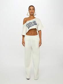 SUMWON WOMEN Bold Back Print High Rise White Baggy Jogger Pants Loose Fit Elastic Waist Street Style Loungewear Fall Winter Fashion Statement Text Print - White - View 3