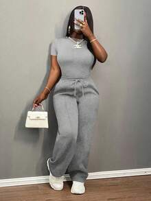 Slaydiva Bộ đồ nữ thường ngày màu trơn, cổ tròn, tay ngắn và quần ống đứng cạp chun, màu nâu, thích hợp cho mùa xuân hè, các lễ hội âm nhạc, lễ Phục Sinh, lễ Thánh Patrick. - Xám - Xem 8