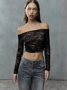 TypaGal Sheer Black Lace And An Off-Shoulder Neckline Create This Flirty Crop Top. Channel Punk Or 2000s Vibes By Pairing It With Distressed Denim Or A Mini Skirt For A Bold Night-Out Look. - Black - View 1