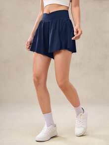 OutZeal Pantalones cortos deportivos para mujer con control de abdomen, absorción de sudor, cintura cruzada, con bolsillo incorporado, para tenis, gimnasio y entrenamiento - Azul - Ver 9