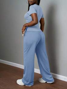 Slaydiva Bộ đồ nữ thường ngày màu trơn, cổ tròn, tay ngắn và quần ống đứng cạp chun, màu nâu, thích hợp cho mùa xuân hè, các lễ hội âm nhạc, lễ Phục Sinh, lễ Thánh Patrick. - Màu xanh lam - Xem 2