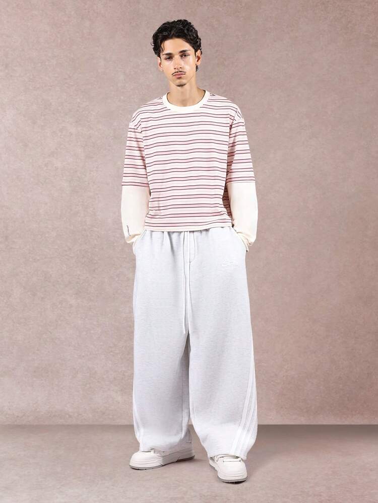 T-shirt rayé à manches doubles et tissu côtelé