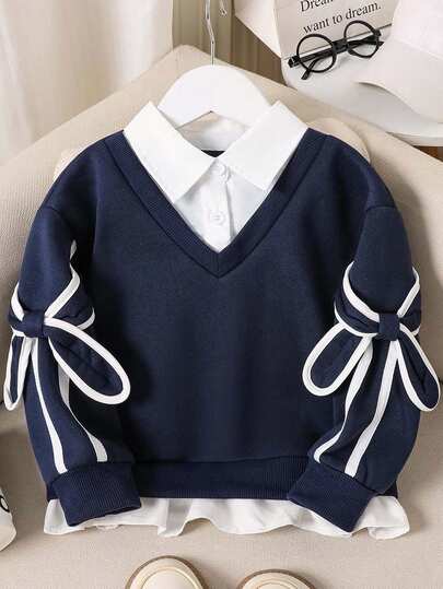 女童二合一蝴蝶结装饰长袖可爱卫衣，适合秋冬季节穿着。