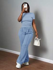 Slaydiva Bộ đồ nữ thường ngày màu trơn, cổ tròn, tay ngắn và quần ống đứng cạp chun, màu nâu, thích hợp cho mùa xuân hè, các lễ hội âm nhạc, lễ Phục Sinh, lễ Thánh Patrick. - Màu xanh lam - Xem 6