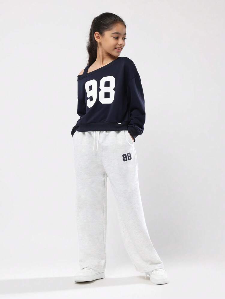 Bluza z odkrytymi ramionami i szerokimi nogawkami