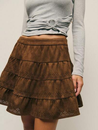 Nöista Faux Suede Boho Mini Skirt With Eyelet Lace Trim, A-Line Silhouette And Brown Color. Spring, Summer Outfit For Women, Vacation, Casual Holiday,