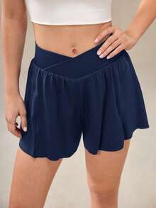 OutZeal Pantalones cortos deportivos para mujer con control de abdomen, absorción de sudor, cintura cruzada, con bolsillo incorporado, para tenis, gimnasio y entrenamiento - Azul - Ver 10