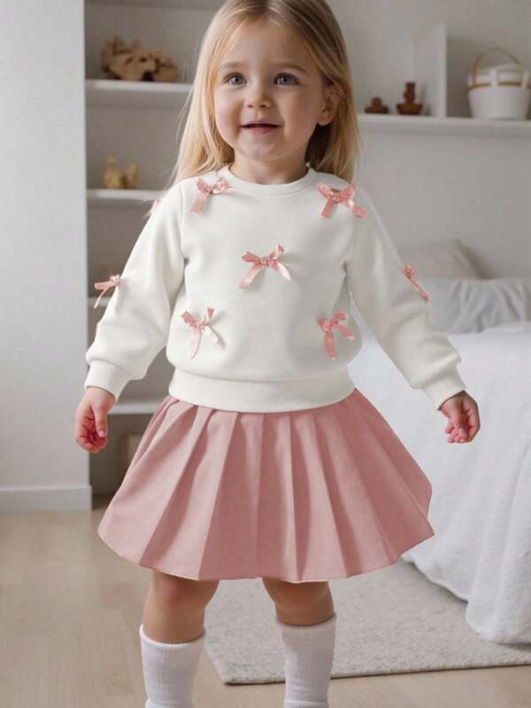 SHEIN Playful Pals Set casual da 2 pezzi per bambina, felpa a maniche lunghe gialla con fiocco pesca abbinata a gonna plissettata marrone chiaro, adatto per uso quotidiano, scuola, fotografia, raduni, primavera/autunno