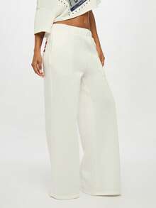 SUMWON WOMEN Bold Back Print High Rise White Baggy Jogger Pants Loose Fit Elastic Waist Street Style Loungewear Fall Winter Fashion Statement Text Print - White - View 6