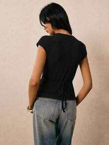 Poéselle T-shirt à la mode pour femmes avec décoration de coquille métallique, col en V et manches chauve-souris