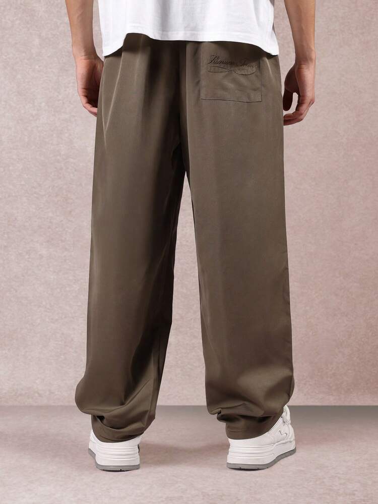 Pantalon large en nylon avec plis sur le devant