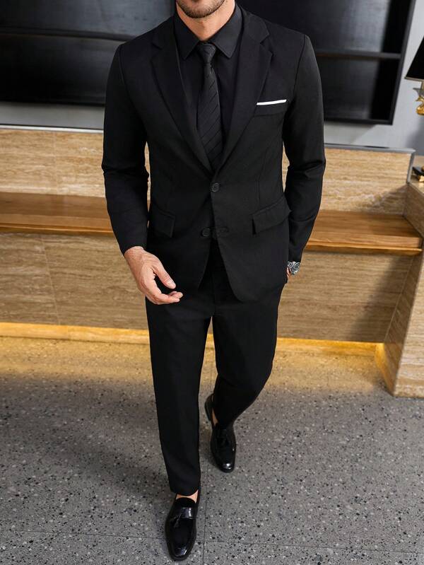 Manfinity Bizformal 1 set Veste de costume décontracté et pantalon à simple boutonnage pour hommes, avec un design de col châle pour un style et un layering supplémentaires. Convient pour le travail, les affaires, les fêtes et les banquets. Cet ensemble de costume est une pièce polyvalente indispensable dans la garde-robe d'un homme, en faisant un excellent cadeau pour les petits amis ou les maris.