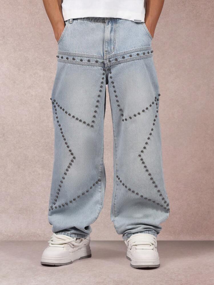 Pantaloni in denim a gamba larga con borchie e motivo geometrico