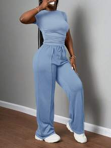 Slaydiva Bộ đồ nữ thường ngày màu trơn, cổ tròn, tay ngắn và quần ống đứng cạp chun, màu nâu, thích hợp cho mùa xuân hè, các lễ hội âm nhạc, lễ Phục Sinh, lễ Thánh Patrick. - Màu xanh lam - Xem 5