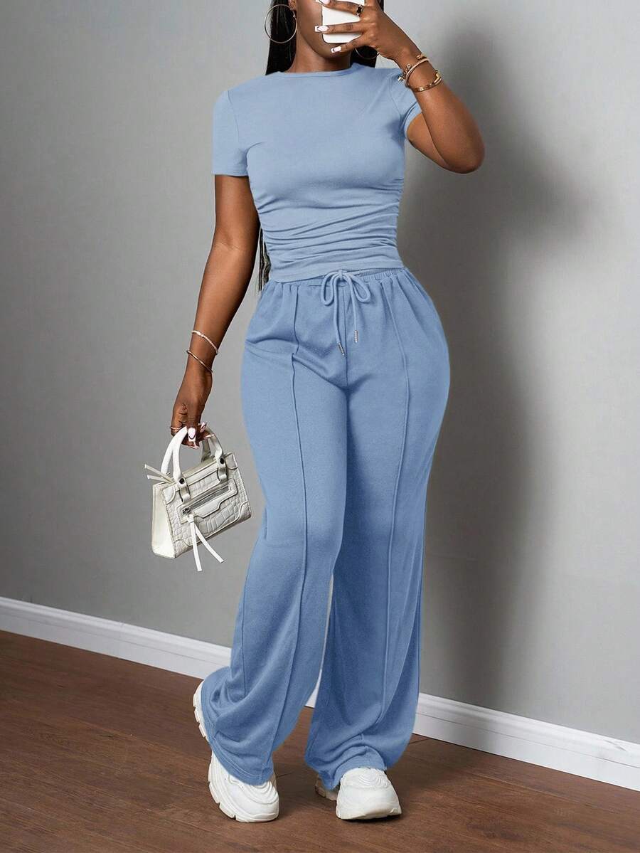 Slaydiva Bộ đồ nữ thường ngày màu trơn, cổ tròn, tay ngắn và quần ống đứng cạp chun, màu nâu, thích hợp cho mùa xuân hè, các lễ hội âm nhạc, lễ Phục Sinh, lễ Thánh Patrick. - Màu xanh lam - Xem 1