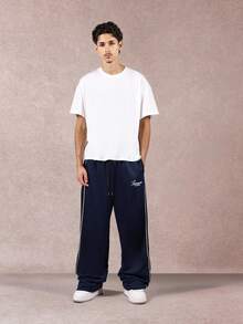 SUMWON 阔腿运动裤街头休闲侧条纹宽松抽绳腰部舒适下装日常弹力踝部秋冬经典款式 - 藏蓝色 - 查看 3