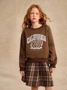 青少年女孩罗纹领、袖口和下摆圆领印花运动衫和格子百褶裙套装