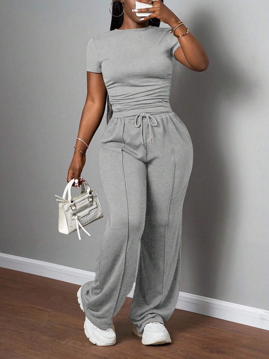 Slaydiva Bộ đồ nữ thường ngày màu trơn, cổ tròn, tay ngắn và quần ống đứng cạp chun, màu nâu, thích hợp cho mùa xuân hè, các lễ hội âm nhạc, lễ Phục Sinh, lễ Thánh Patrick. - Xám - Xem 1