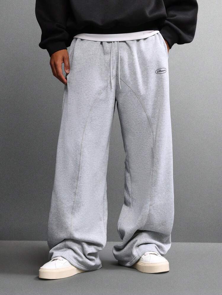 Pantalon de survêtement ample à jambes larges avec coutures apparentes