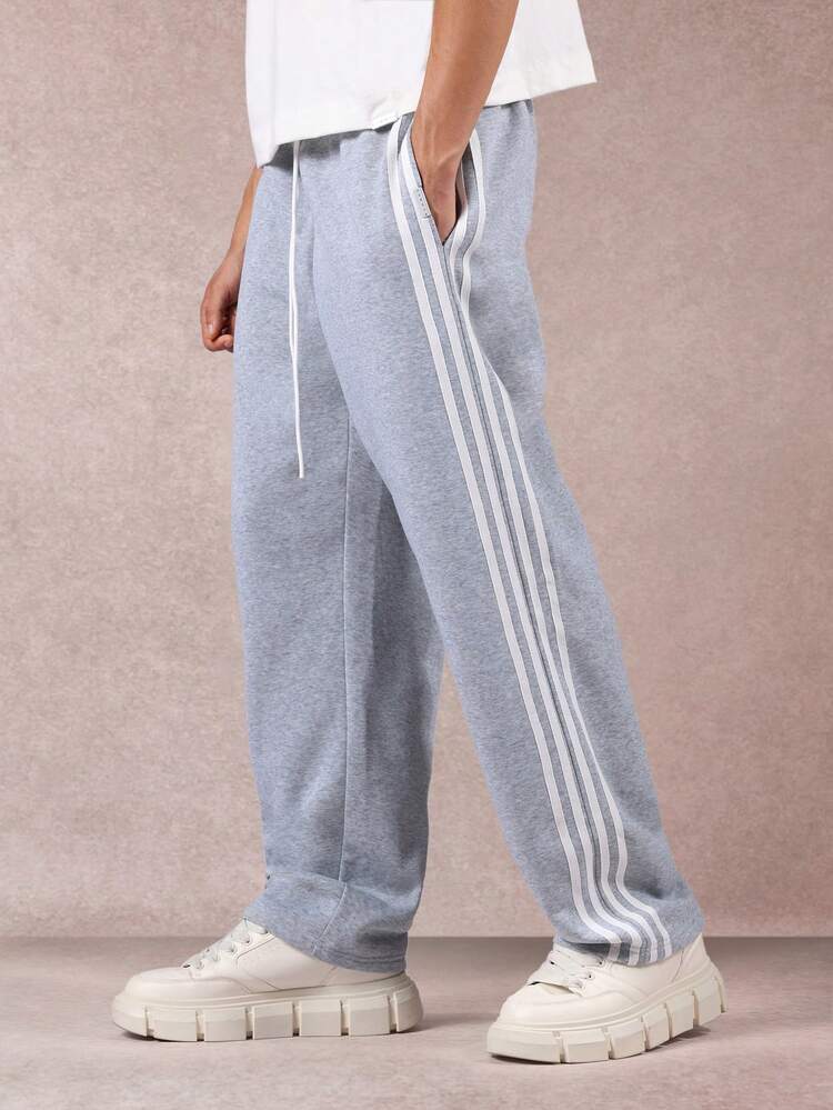 Melanżowe spodnie dresowe z potrójnymi paskami po bokach i elastycznymi mankietami