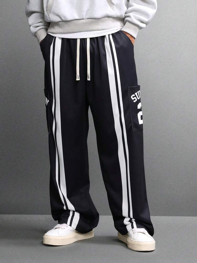 Relaxed Track Pants With Side Stripes And Text Detail