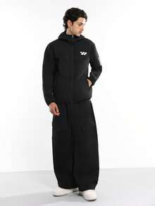 SUMWON Premium Waterproof Shell Jacket Full Zip Windbreaker With Chest Logo Lightweight Outdoor Hood Utility Travel Essential Weather Protection - Black - View 6