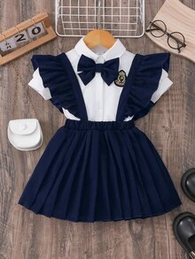 Girls' Navy Academic Style Cap Sleeve Collar Badge 3D Bowknot Shirt And Criss-Cross Flare Sleeve Pleated Suspender Skirt Set Cute School Clothes Uniform