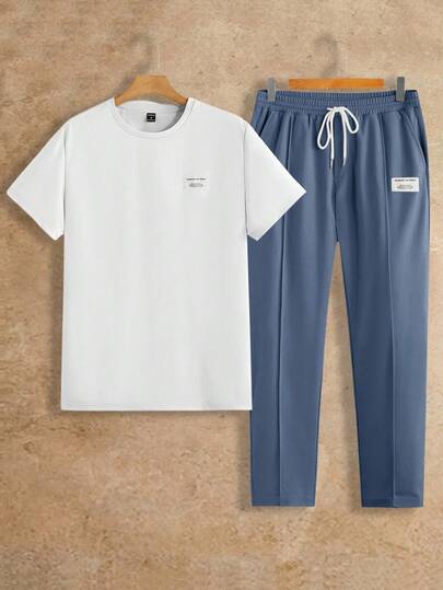 Manfinity BRENVOR مجموعة من قطعتين للرجال، تي شيرت بياقة دائرية وأكمام قصيرة مزين بشارة قطنية وبنطال بخصر مطاطي، مناسب للارتداء اليومي، ملابس مريحة