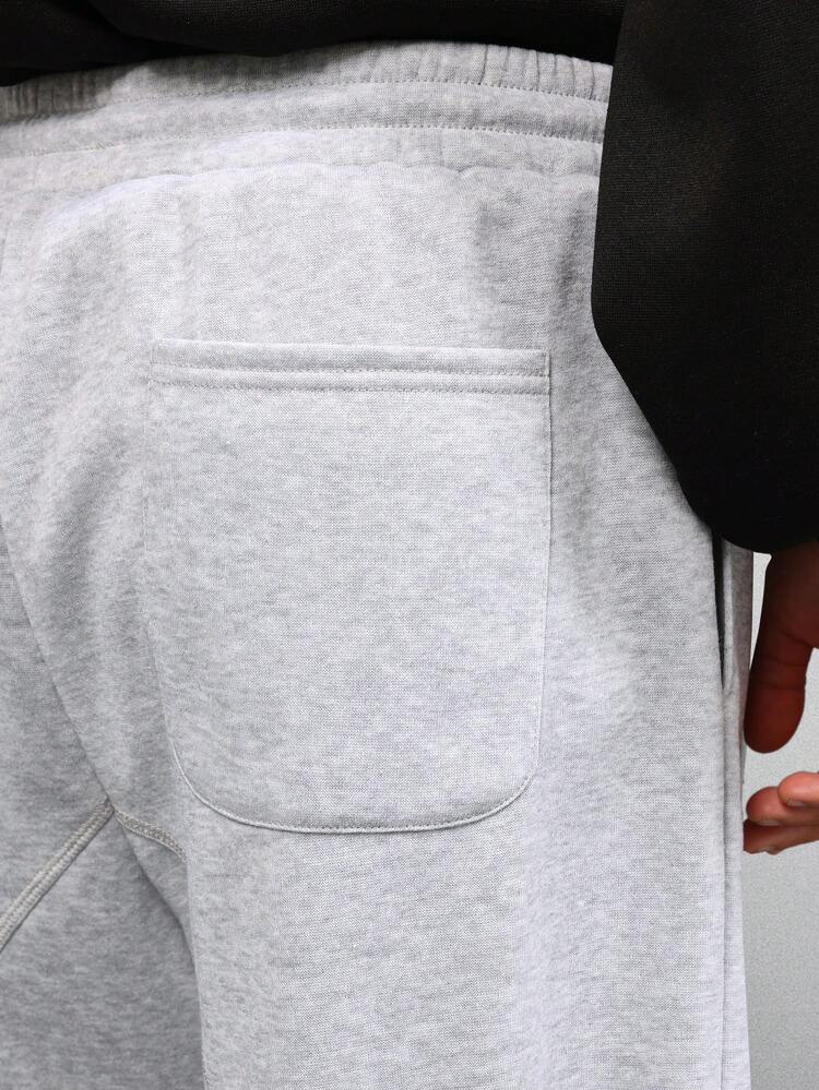 Pantalon de survêtement ample à jambes larges avec coutures apparentes