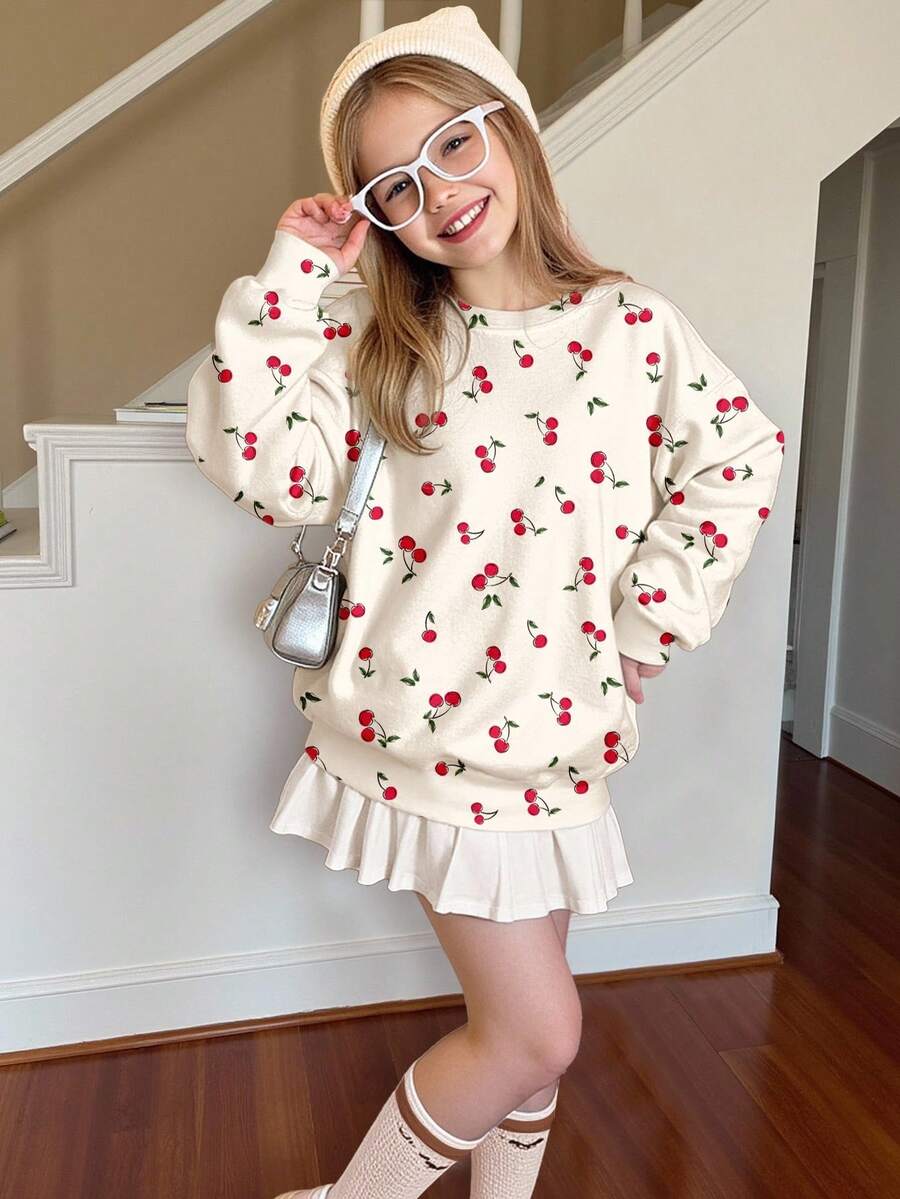 SHEIN Leap Crew Áo nỉ dài tay cổ tròn mềm mại, màu trắng kem, họa tiết quả anh đào nhỏ dễ thương kiểu vintage dành cho bé gái, thích hợp cho mùa thu/đông, đi chơi mùa thu, thoải mái dễ chịu, mặc nhiều lớp mùa thu, thời trang, trang phục thường ngày, họa tiết, thích hợp cho năm học mới, lễ hội, phù hợp cho ở nhà, ngoài trời, trường học, chụp ảnh đường phố, dã ngoại, nông trại. - Nhiều màu - Xem 1