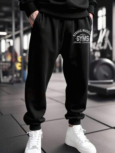 Manfinity Sport Corelite Pantalones casuales tipo jogger con cordón para hombres con estampado de letras en el bolsillo