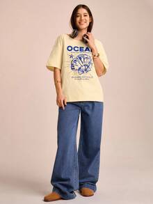 CAJUNI T-shirt ample à manches courtes asymétrique pour femmes en vacances avec imprimés de coquillages, d'étoiles de mer et d'hippocampes. Polyvalent pour l'été